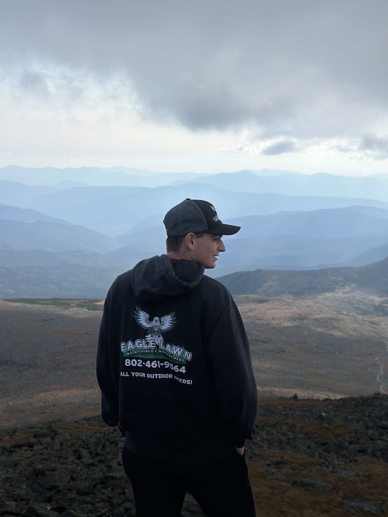 Eagle Lawn & Snow crew member looking over the mountains